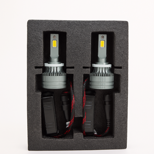 Two car LED headlights in a black foam packaging on a white background