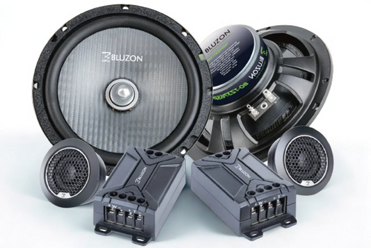 Car speakers and audio components on a white background