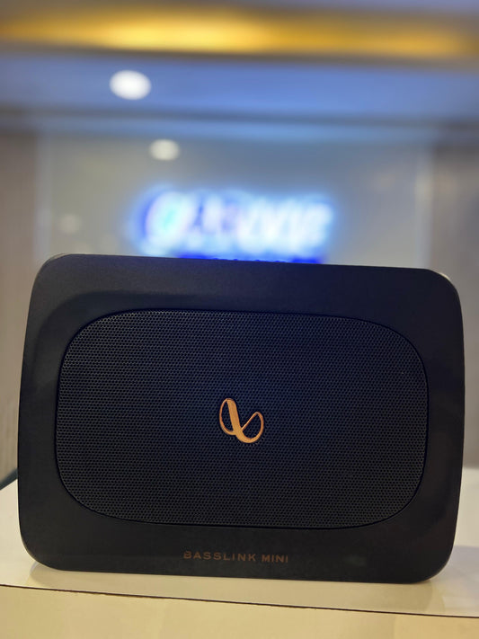 Blue and black device with a logo on a reflective surface