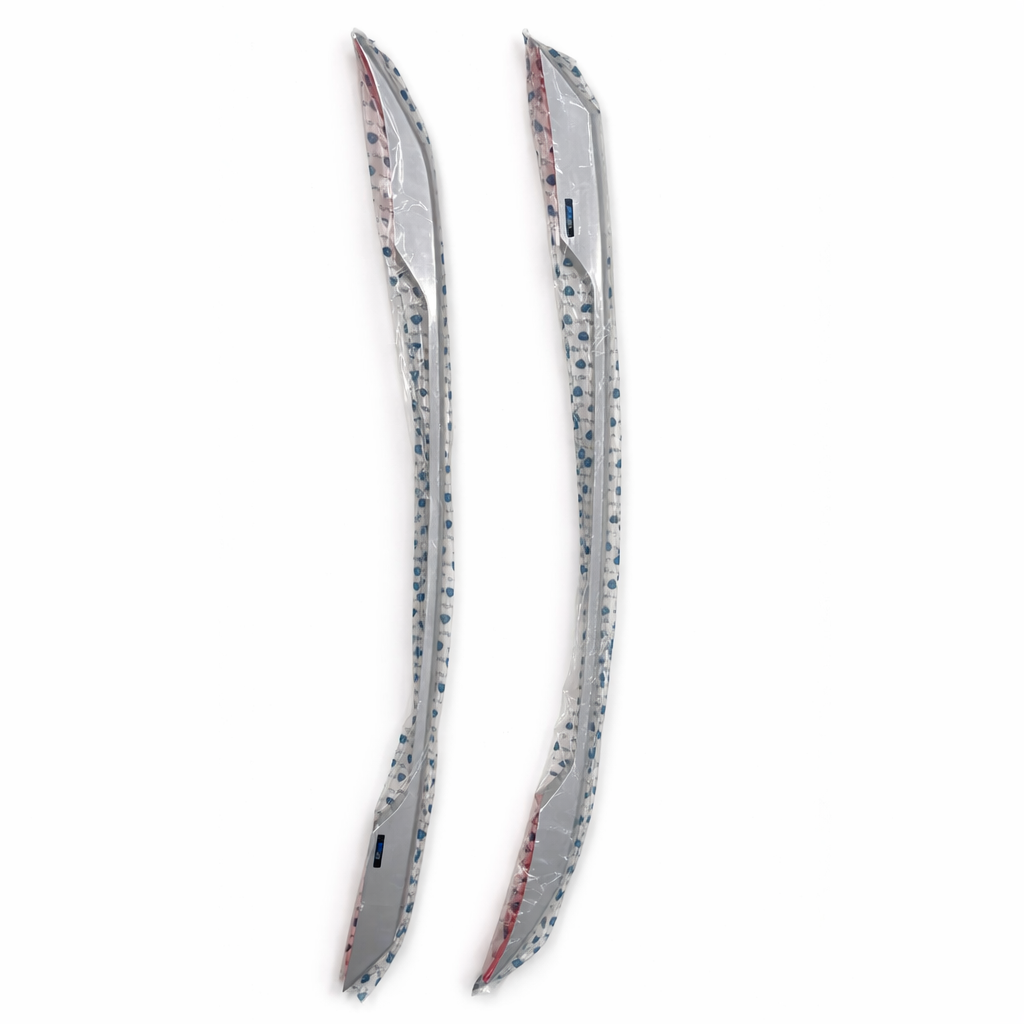 Two metallic car side mirrors on a white background