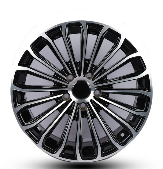 Black and silver alloy wheel rim on a white background