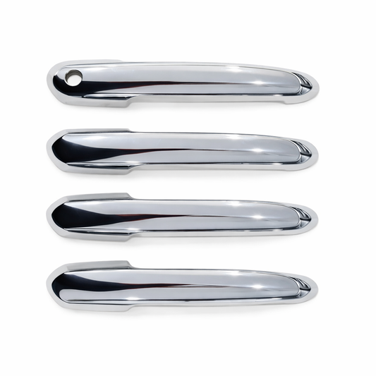 Four chrome car door handles on a white background