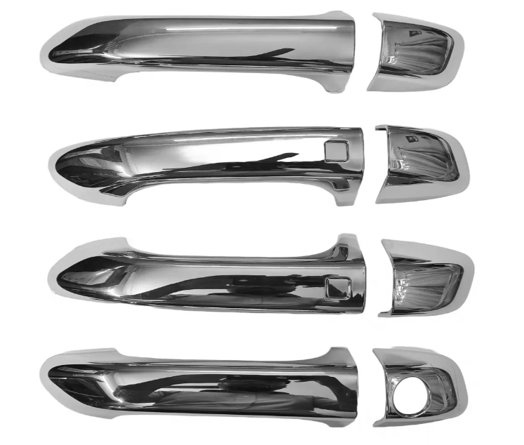 Set of chrome car door handles on a white background