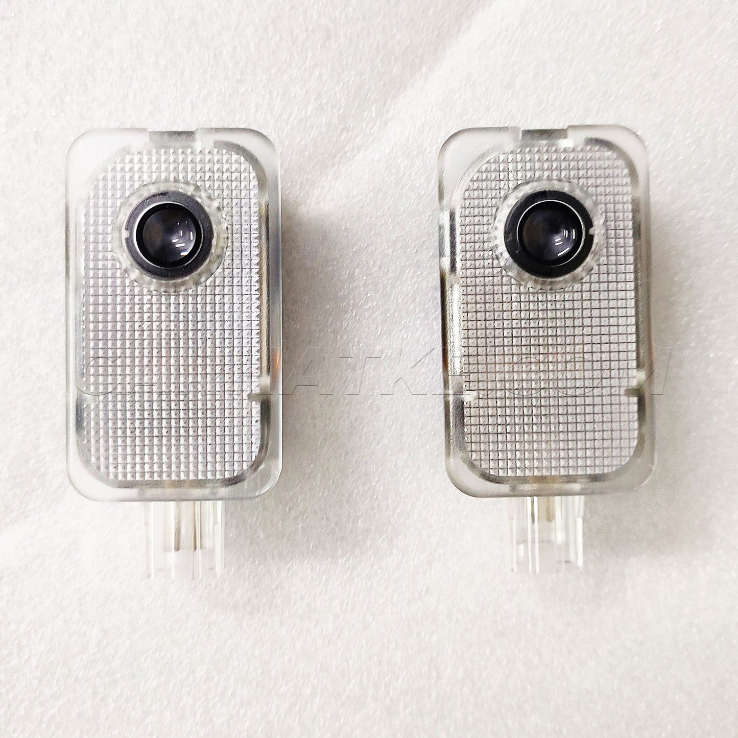 Two electronic devices with camera lenses on a white background