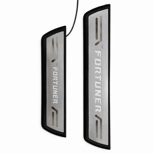 Two Fortuner branded car door sill protectors on a white background