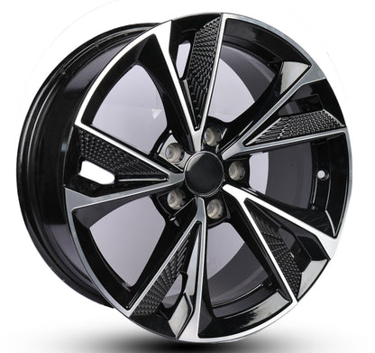 Black alloy wheel with reflective surface on a white background