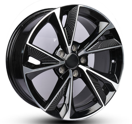 Black alloy wheel with reflective surface on a white background