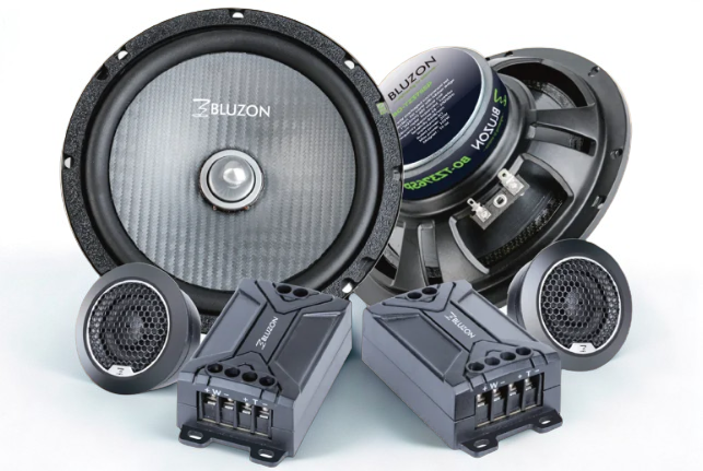 Car speakers and audio components on a white background