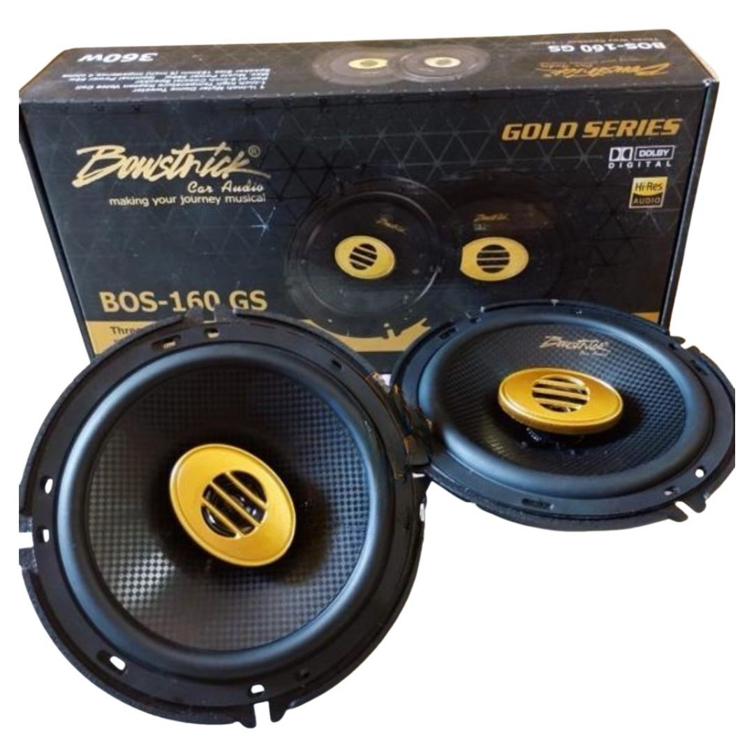 Pair of car speakers with 'Bomster' branding and a black and gold box in the background.