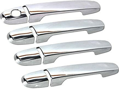 Set of four chrome car door handles on a white background