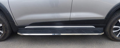Side step bar on a vehicle with a gray background