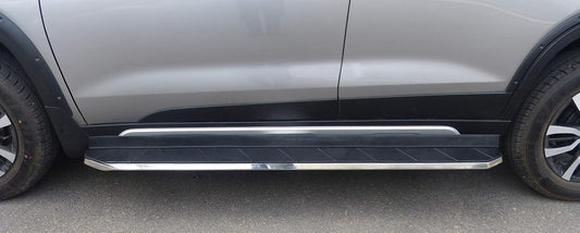 Side step bar on a vehicle with a gray background