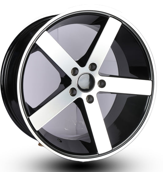 Car wheel rim with black and silver finish on a white background
