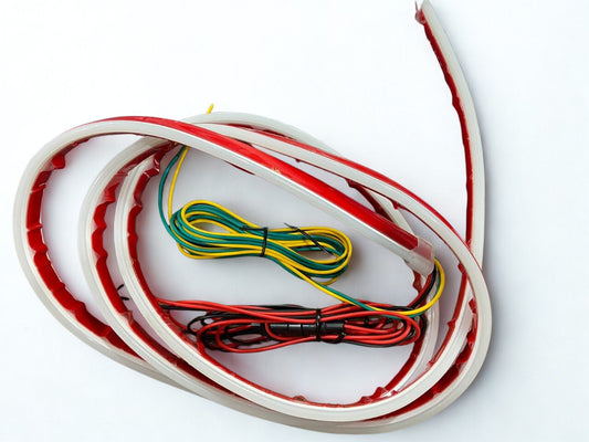 Set of red, green, and yellow wires on a white background