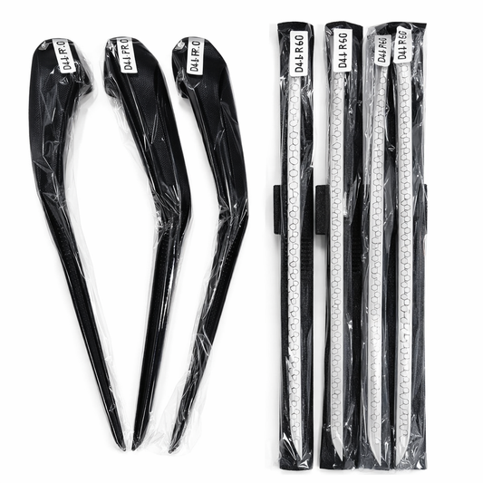 Set of black hair clips and clear plastic rulers with visible branding on a white background