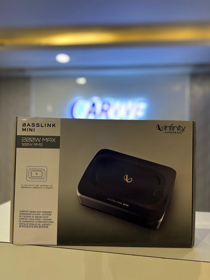 Box with Basslink Mini product on a blurred indoor background