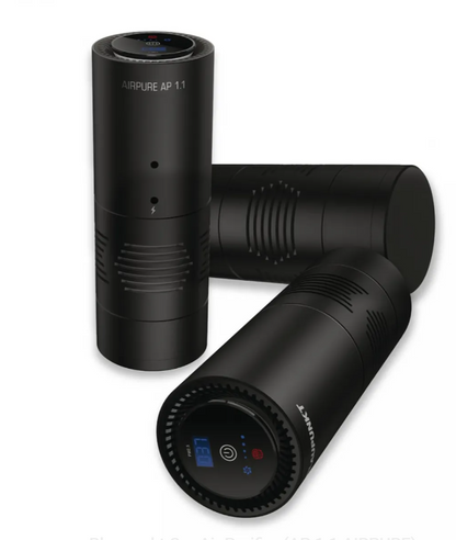 Black cylindrical air purifiers on a white background