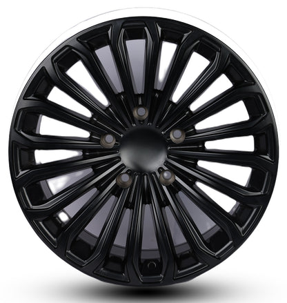 Black car wheel rim on a white background