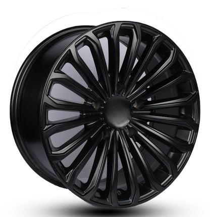 Black alloy wheel on a white background