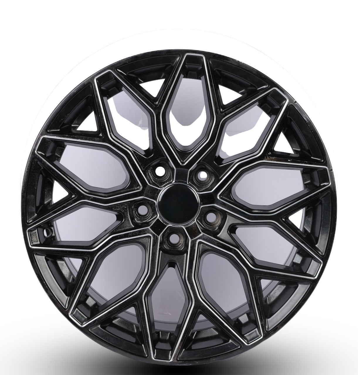 Black alloy wheel on a white background