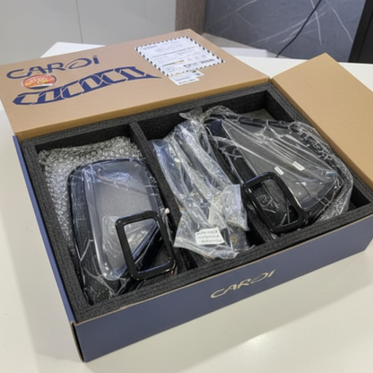 Box containing car key fobs with CAROI branding on a light background