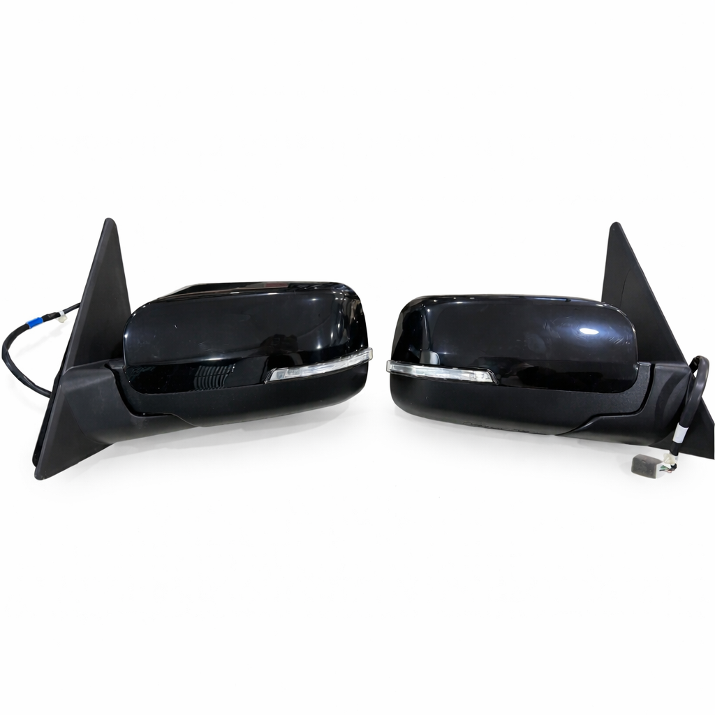 Pair of black car side mirrors on a white background