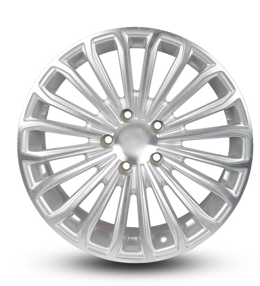 Silver car wheel rim on a white background