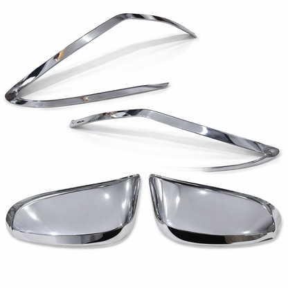 Set of chrome car mirror covers on a white background