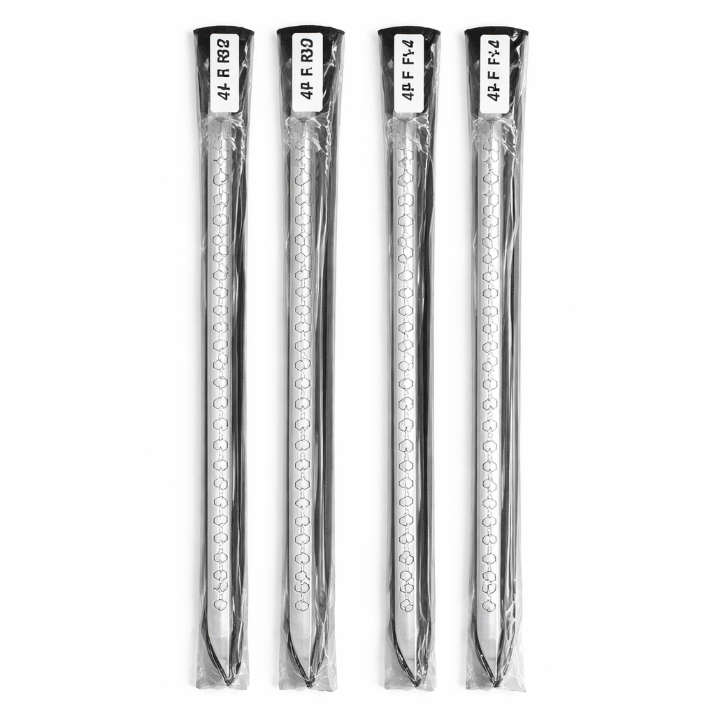 Four golf club shafts in clear packaging on a white background