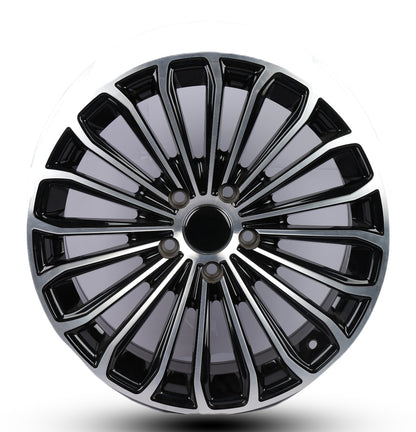 Black and silver alloy wheel rim on a white background