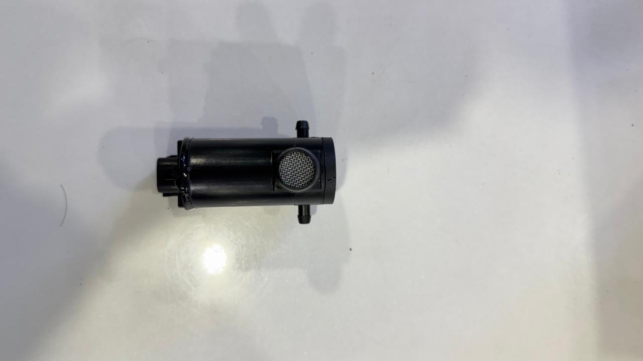 Black cylindrical object on a white background