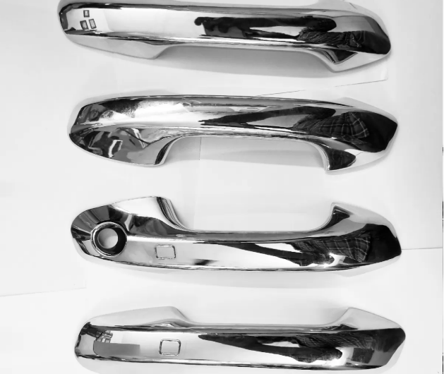 Chrome car fender flares on a white background