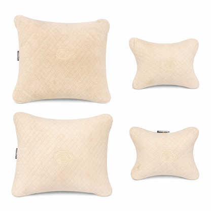 Four beige textured pillows on a white background