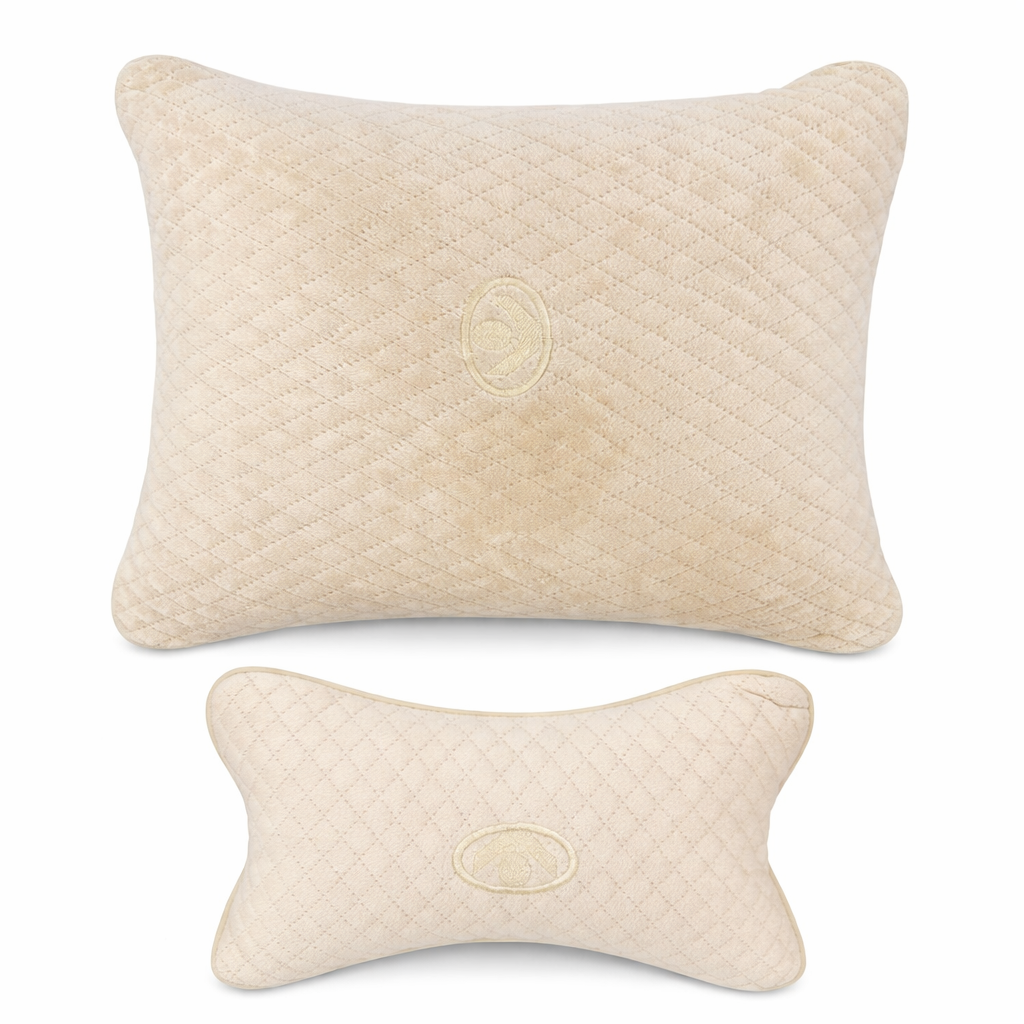 Two beige textured pillows on a white background