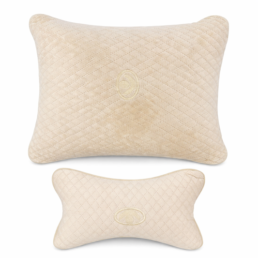 Two beige textured pillows on a white background