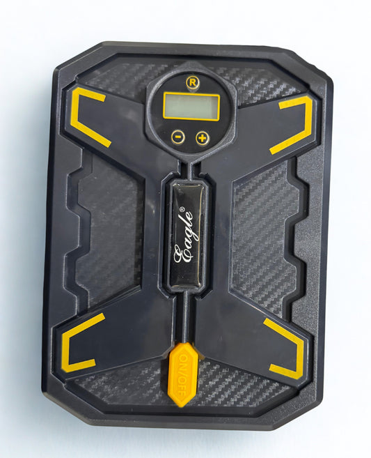 Black and yellow digital tire pressure gauge on a light gray background