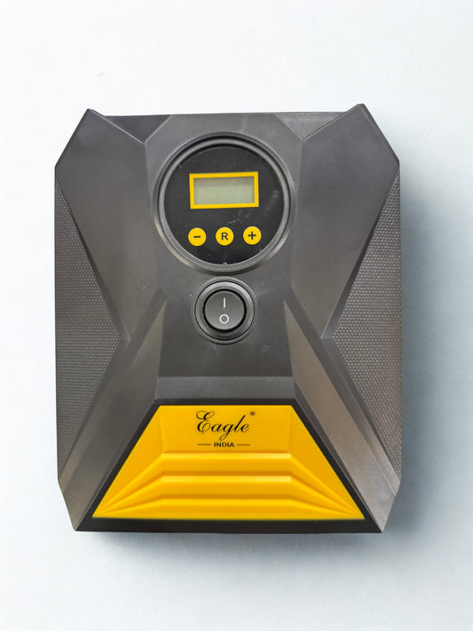 Gray and yellow electronic device with digital display on a white background