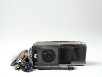 Black electronic device with a cable on a white background