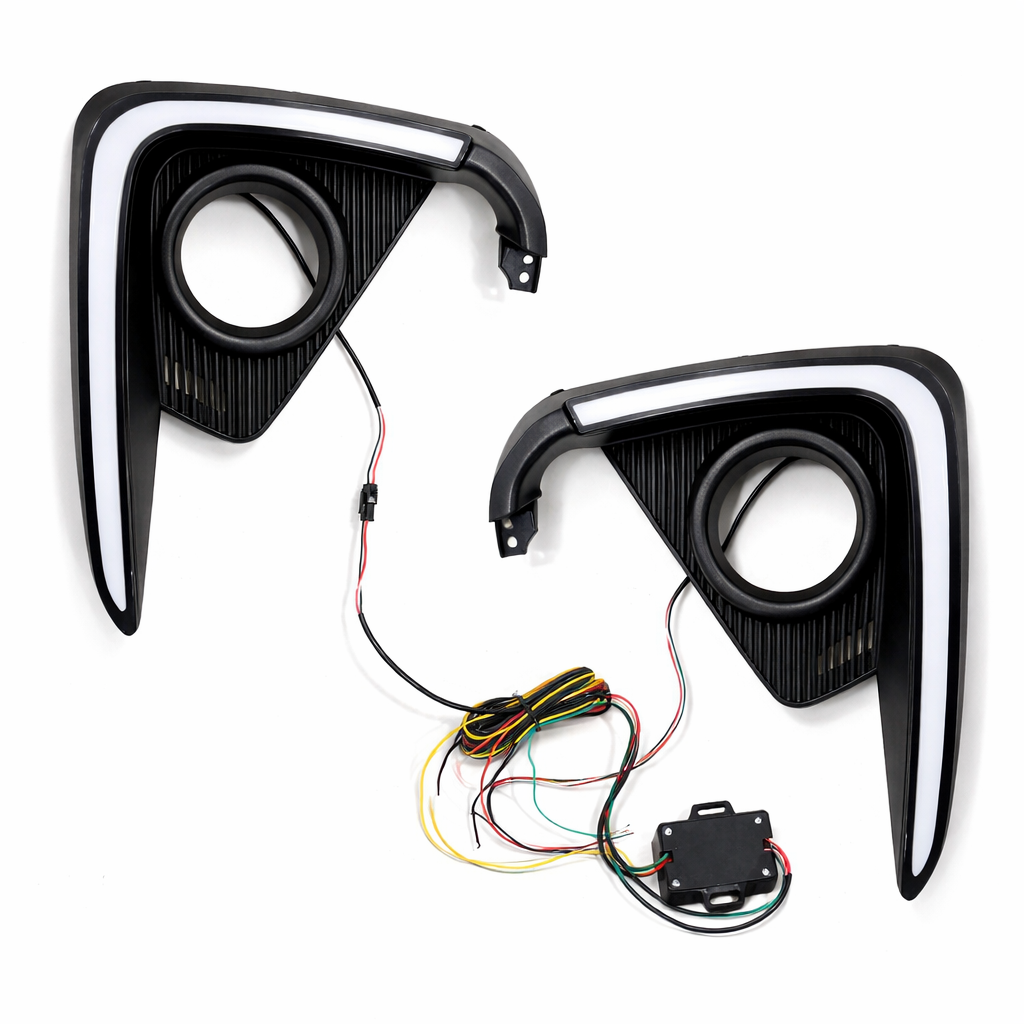 Two car fog light assemblies with wiring on a white background