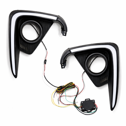 Two car fog light assemblies with wiring on a white background
