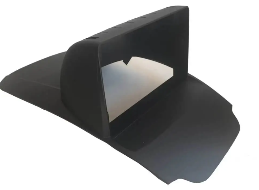 Black plastic component on a white background