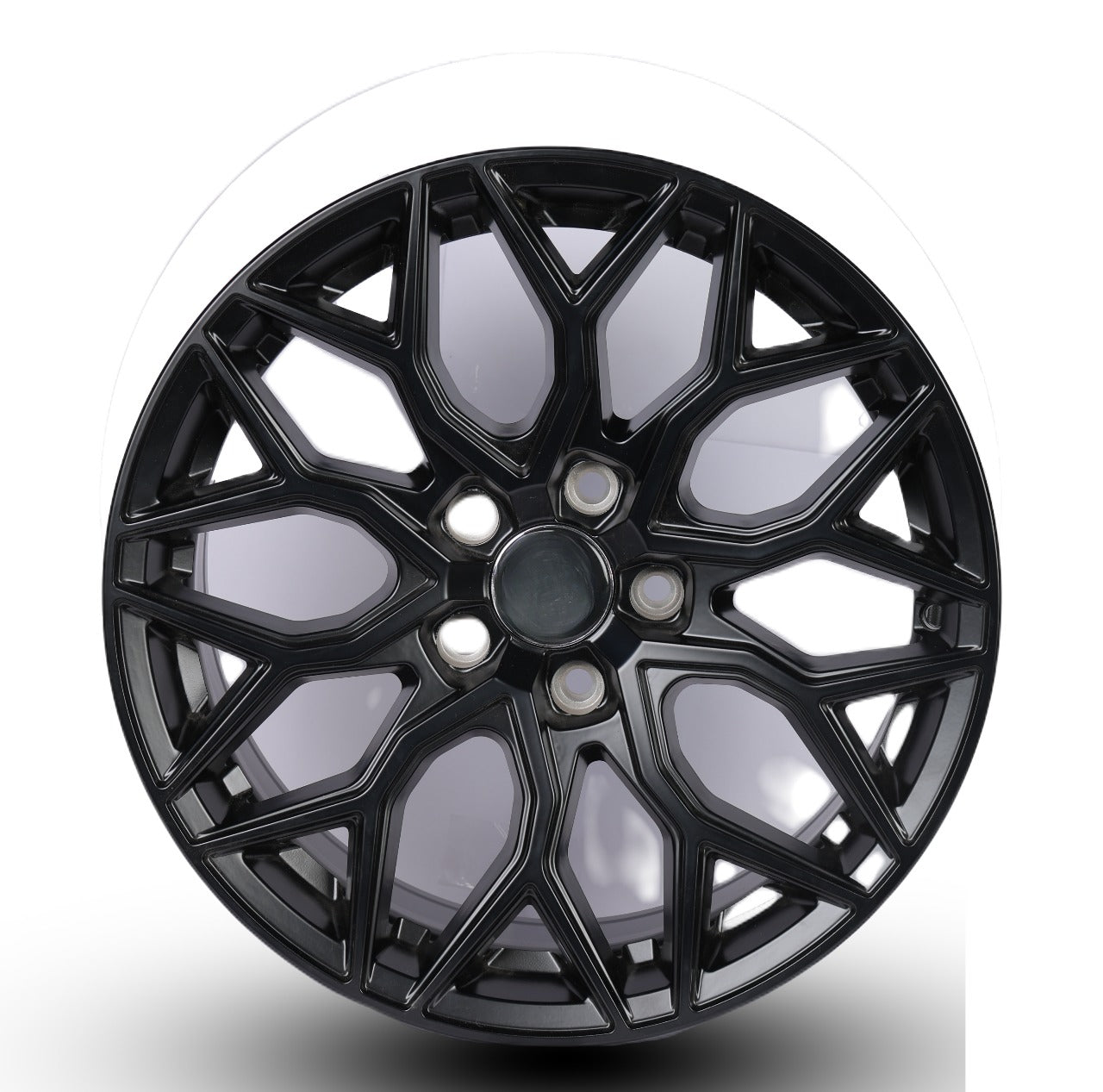 Black alloy wheel on a white background