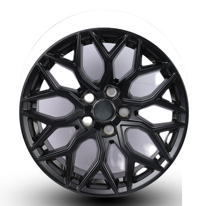 Black alloy wheel on a white background