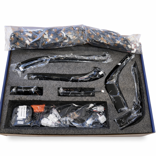 Automotive parts in a box with clear plastic packaging on a white background
