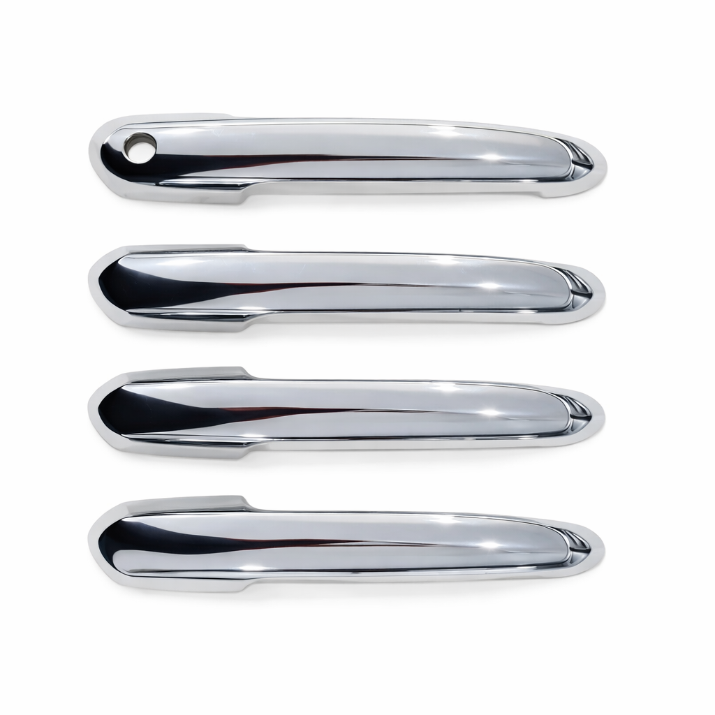 Four chrome car door handles on a white background