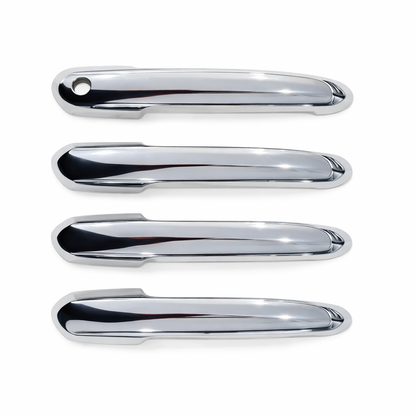 Four chrome car door handles on a white background