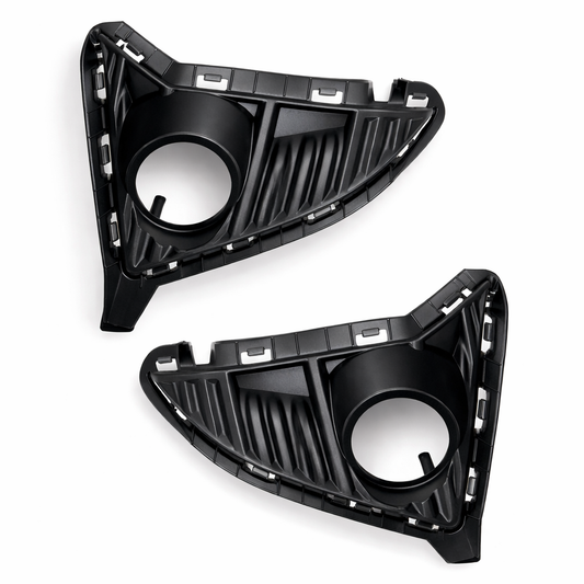 Two black car headlight covers on a white background