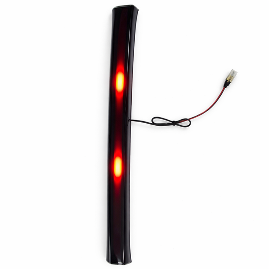 Black LED strip light with red lights on a white background