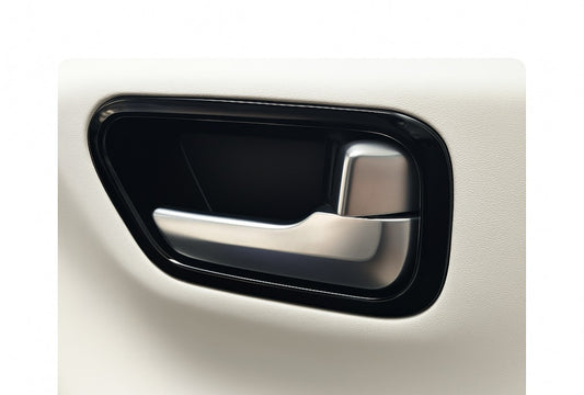 Car door handle with black and silver finish on a white background