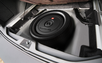 Car subwoofer installed in a vehicle's floor panel.